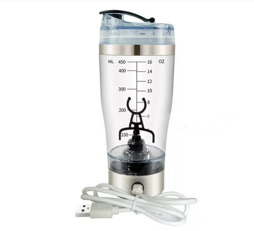 A cup of portable fruit juice, electric fruit mixer, a large cup