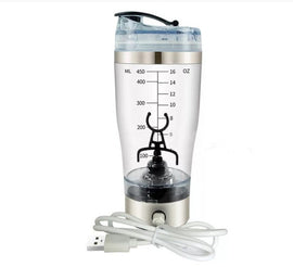 A cup of portable fruit juice, electric fruit mixer, a large cup